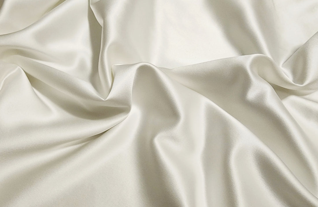 Close-up of white mulberry silk fabric with soft folds