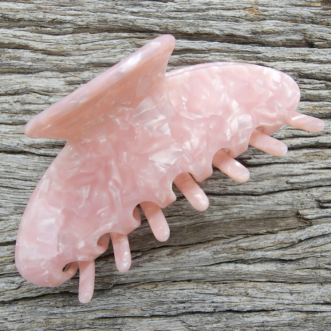 Petal Pink Hair Claw outside in natural light.