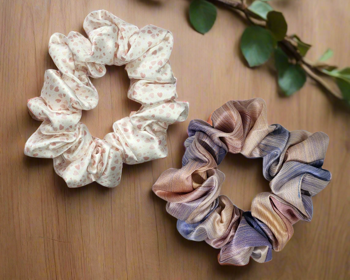 printed 22 momme Mulberry Silk scrunchies, on a wooden table.