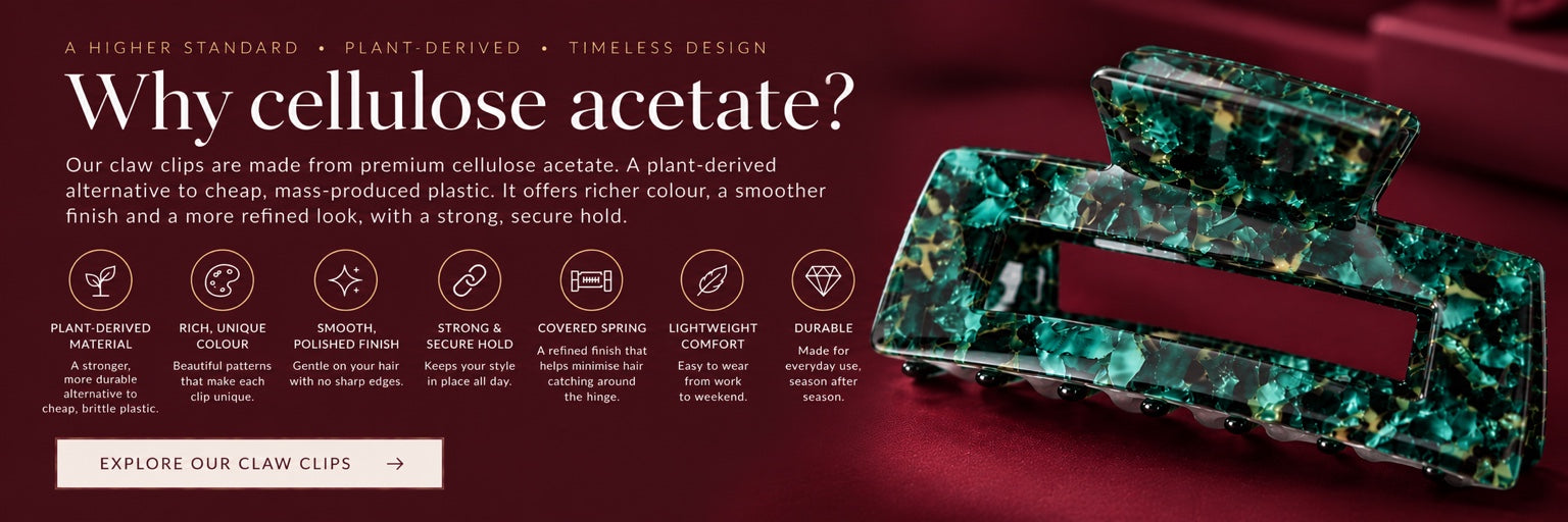 Emerald Edge rectangular claw clip with rich green patterns, photographed on burgundy fabric