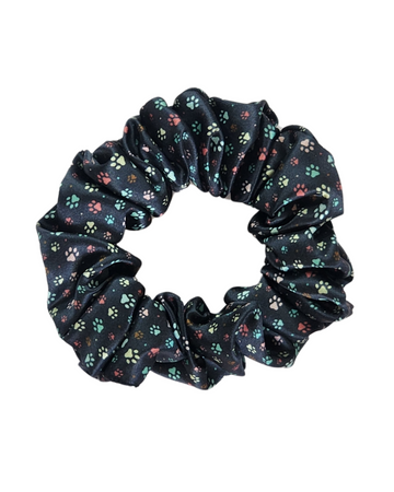 Little Paws classic mulberry silk scrunchie in dark paw print on a white background