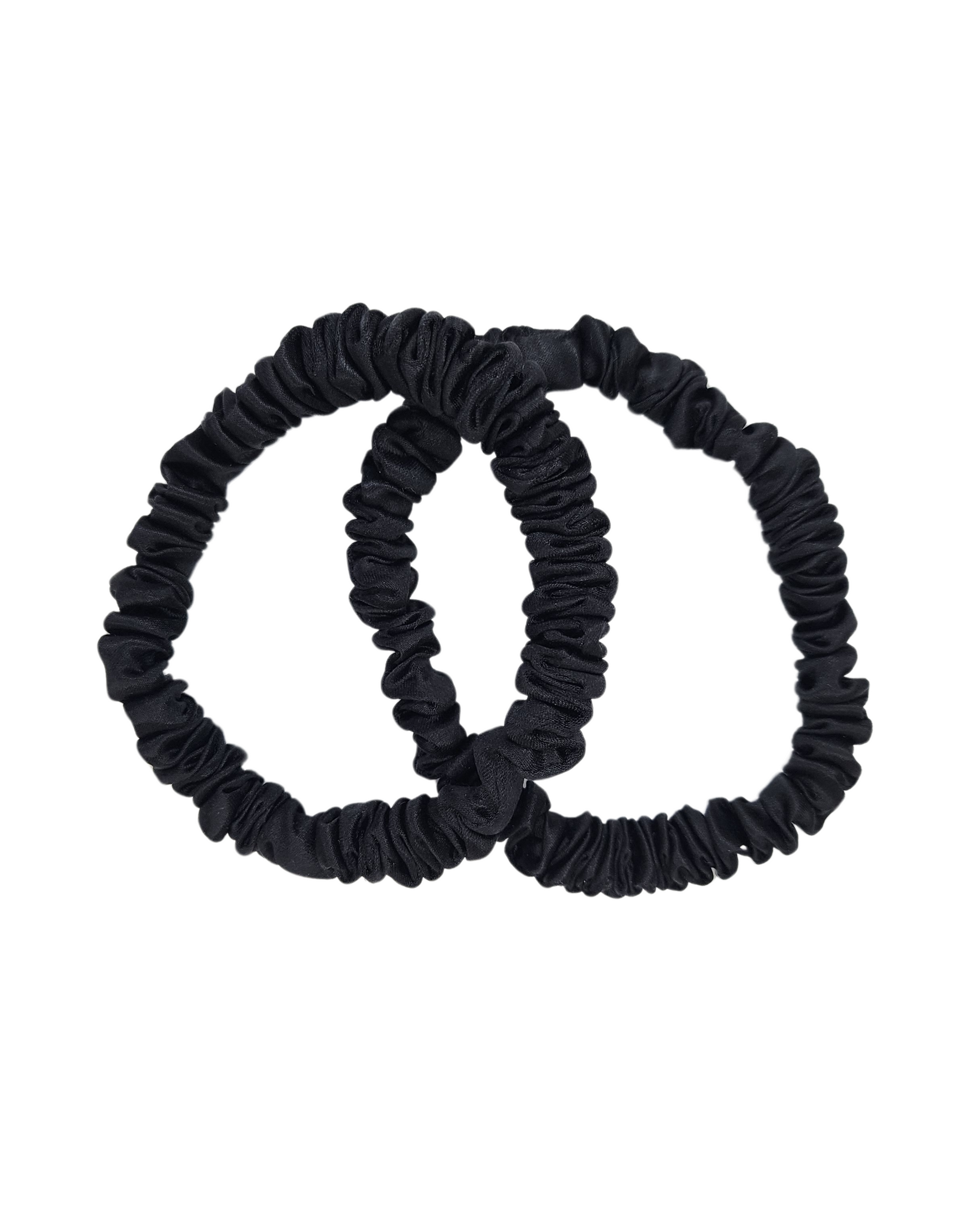 Pair of thin black mulberry silk scrunchies on white background – premium 1cm silk hair ties by The Scrunchie Vault, gentle and sleek for Australian women’s hair care.