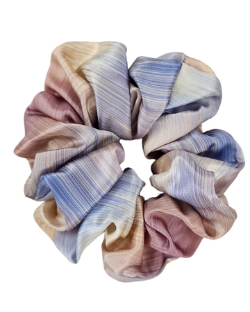 Daydream oversized mulberry silk scrunchie in pastel blue, pink and cream on a white background
